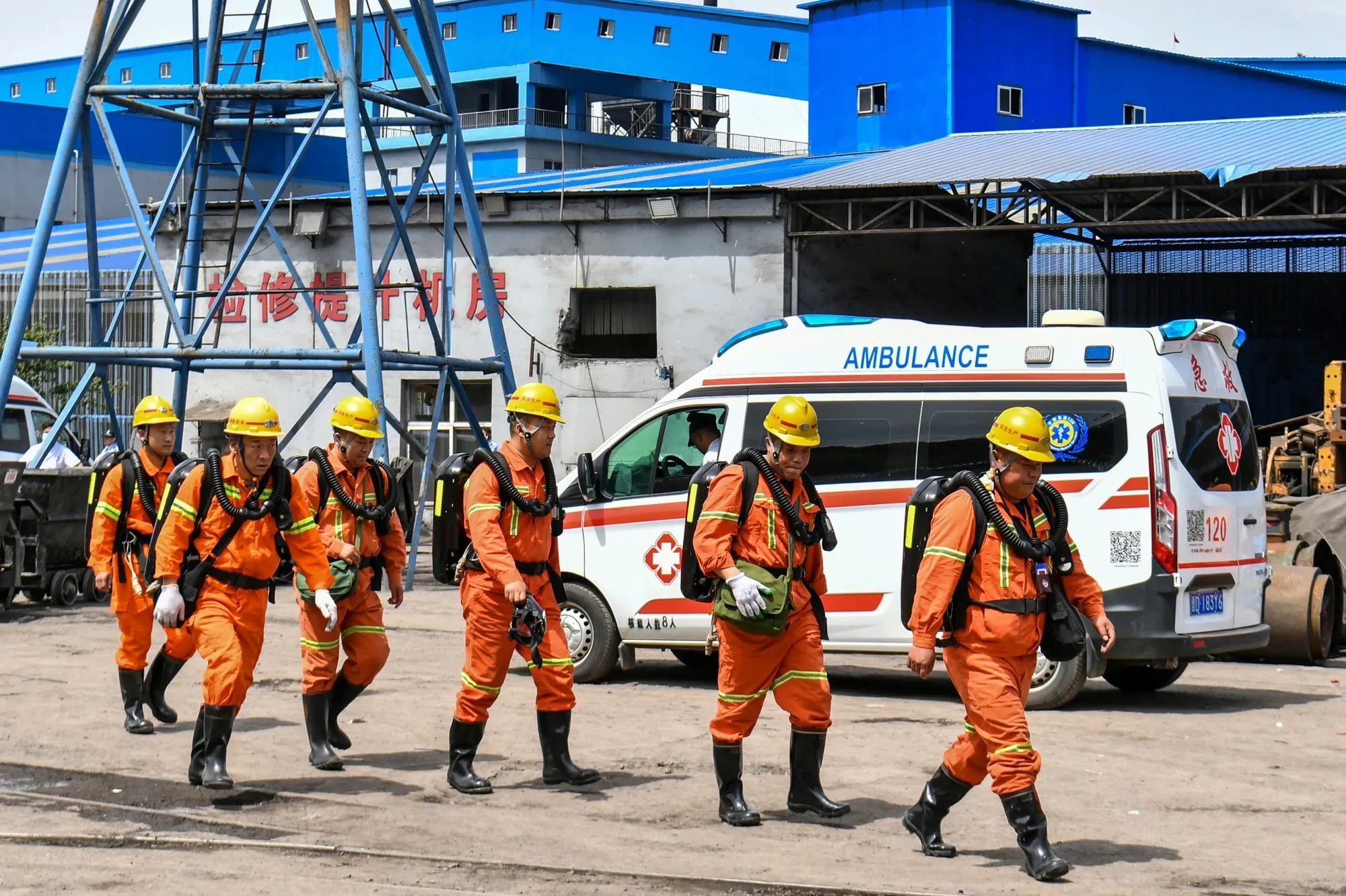 Rescue workers pass by an ambulance in the aftermath of an explosion at Changzhi city’s Liushenyu coal mine in Qinyuan county, northern China’s Shanxi Province on Saturday, May 23, 2026. (Cao Yang/Xinhua via AP)
