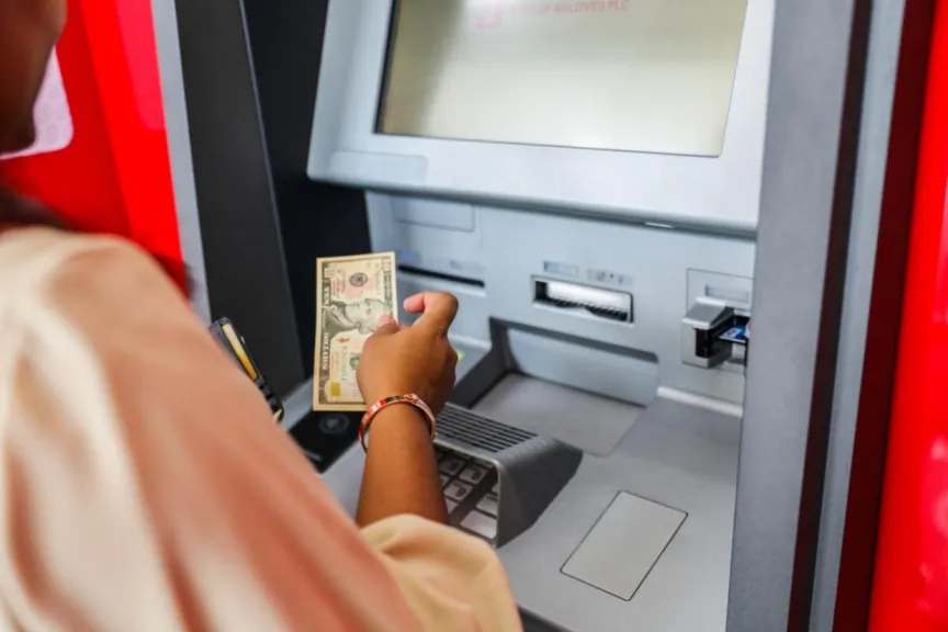 Woman withdrawing money from ATM (Photo/BML)