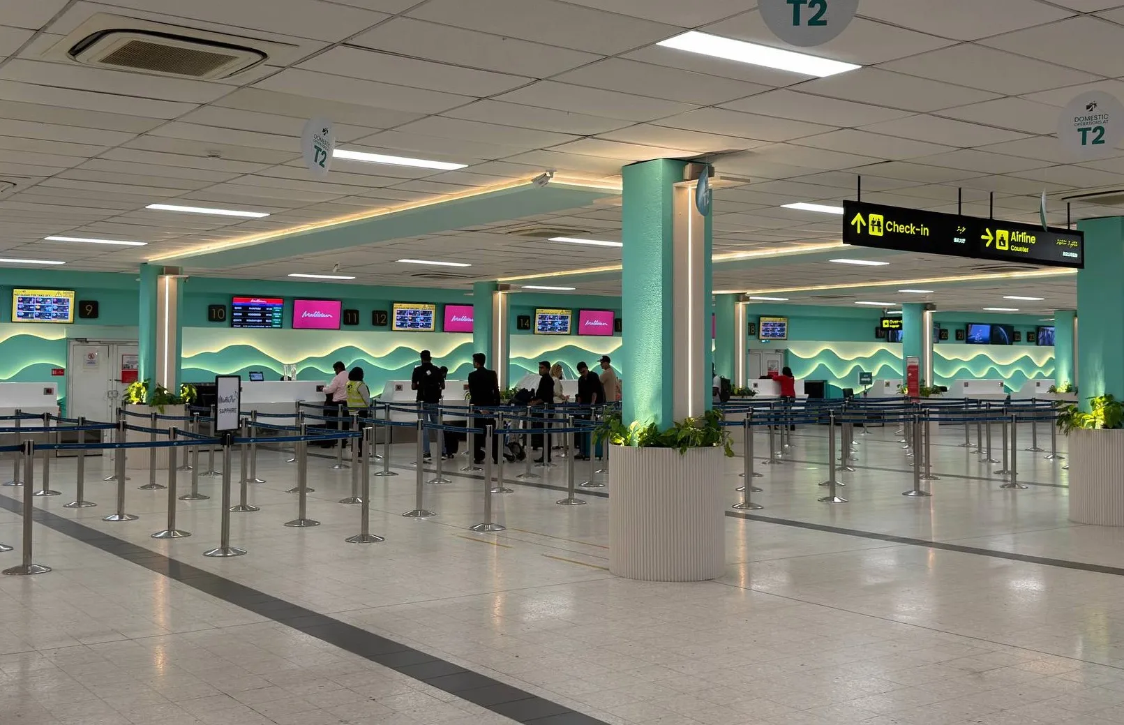 Check-in area at Velana International Airport with fewer passengers than usual