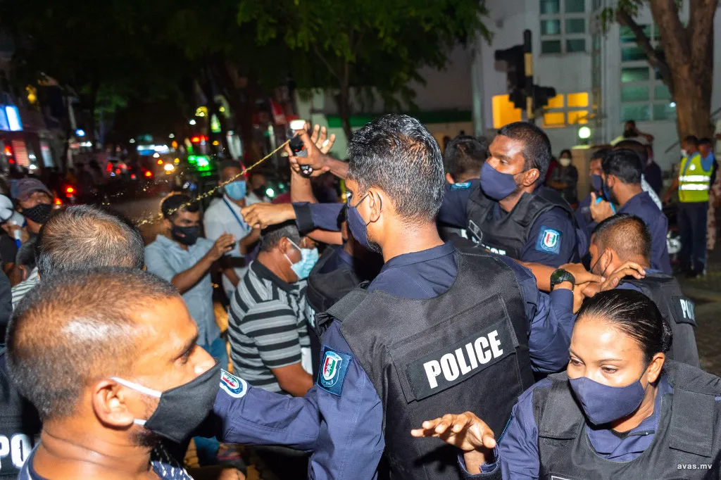 Police pepper spraying in an opposition rally