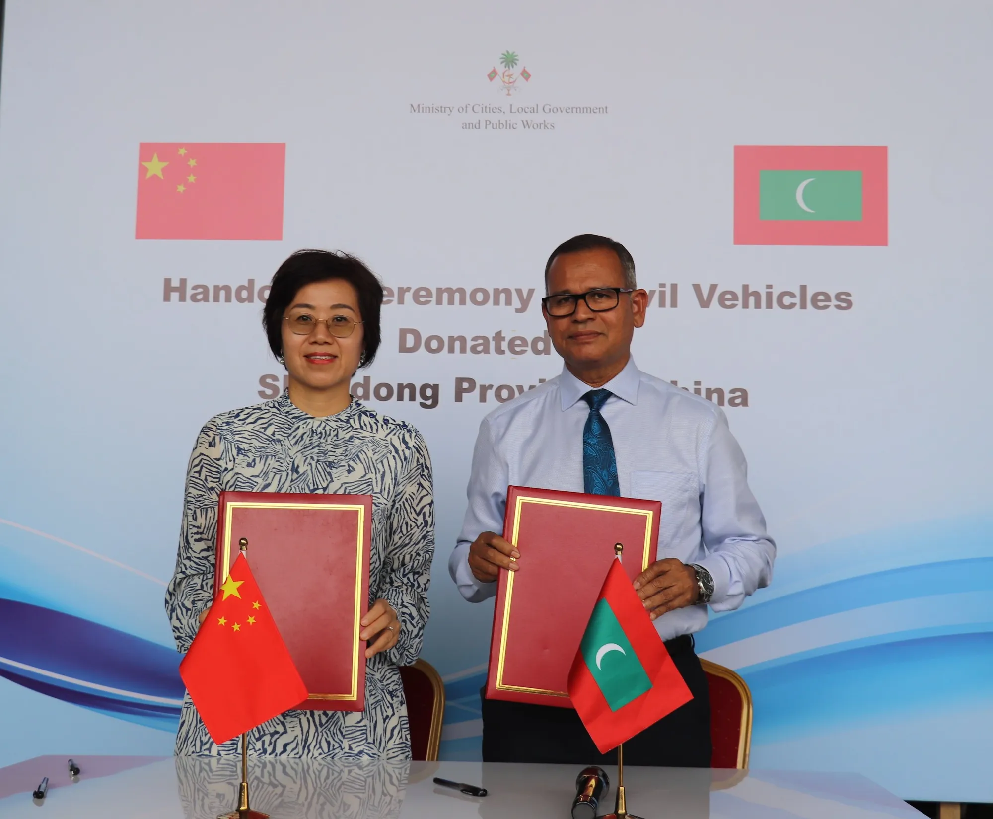 Ambassador Wang Lixin and  Minister of Local Government and Public Works Adam Shareef Umar