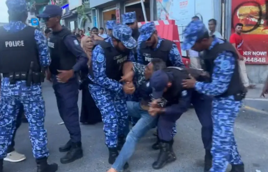 A person being arrested in an opposition protest