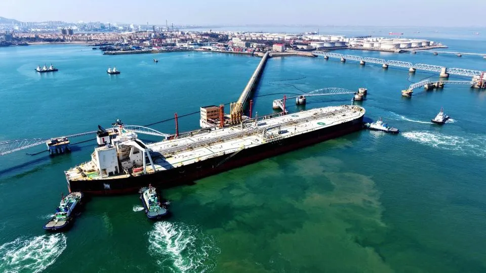 A cargo ship carrying imported crude oil docked at the crude oil terminal berth of Qingdao Port, Qingdao City, Shandong Province, China on March 7, 2026. (Photo/ YFP / CFoto / CFOTO via AFP)