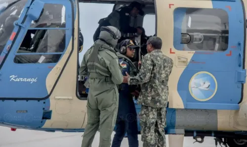 Indian military personnel with Maldivian soldiers operating a helicopter deputed by India. (File Photo/MNDF)