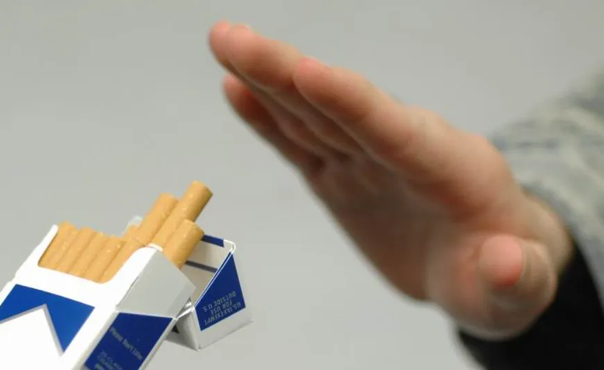 Person saying no to cigarettes