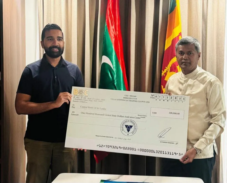 Siyad Qasim, CEO of Villa Resorts handing over the cheque