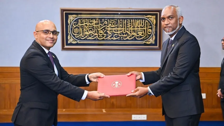 Hassan Zareer receiving his appointment letter today (Photo/President's Office)